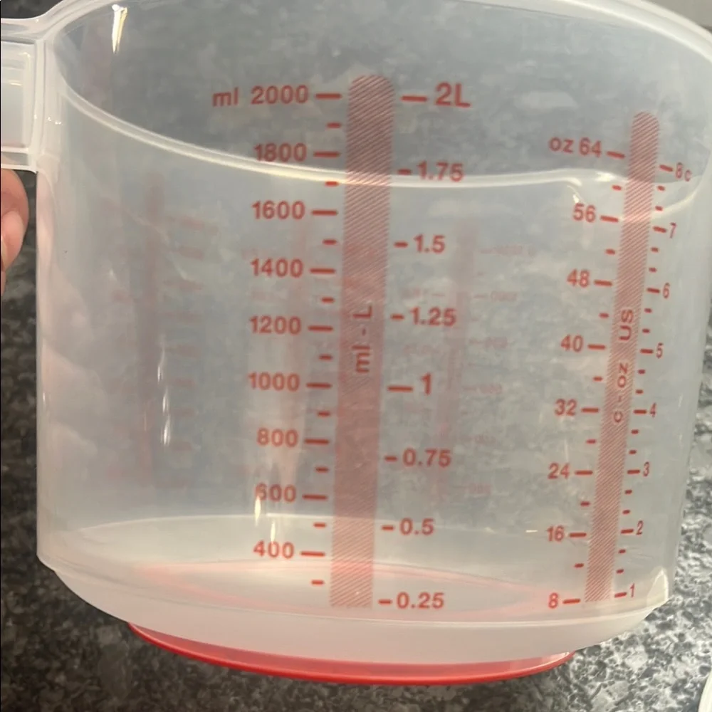 Tupperware Mix n Store Red and White Measuring cup. New without tags